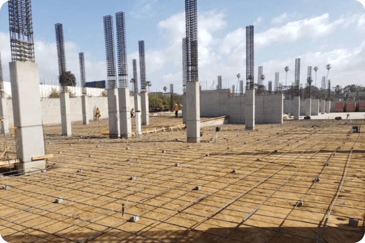 Reinforced concrete slab preparation with rebar grid and vertical column cages